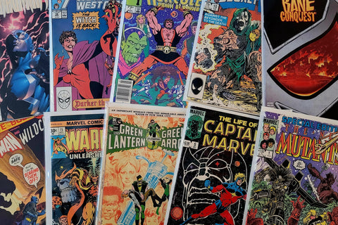Collection of comic books with various superhero characters on covers.